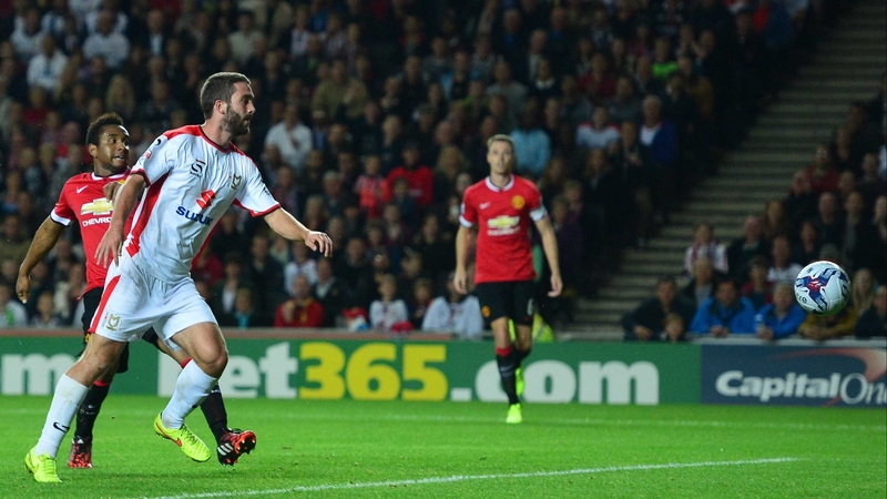 Will Grigg scores against United