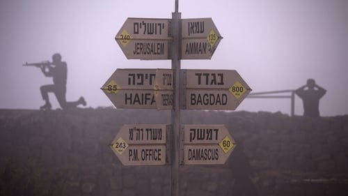 Syrian armed fighters stormed a Golan Heights crossing on Wednesday