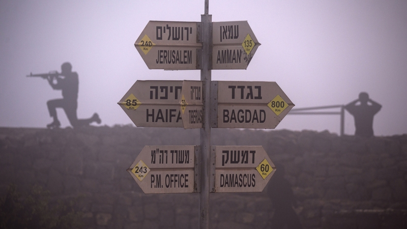 Syrian armed fighters stormed a Golan Heights crossing on Wednesday