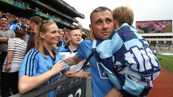 A crestfallen Brogan is consoled by his family after the All-Ireland semi-final defeat to Donegal