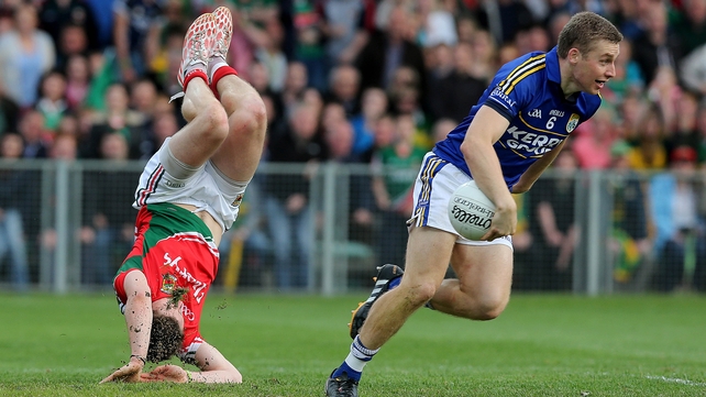 Head over heels - Lee Keegan of Mayo with Peter Crowley of Kerry during the Kingdom's semi-final victory in Limerick