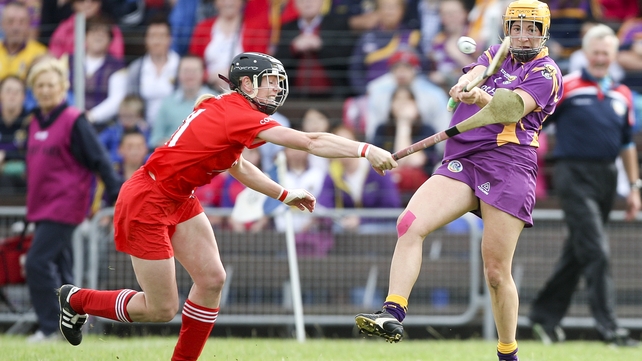 Wexford's Deirdre Codd clears the sliotar as Angela Walsh of Cork closes in during the Rebelettes' All-Ireland semi-final victory