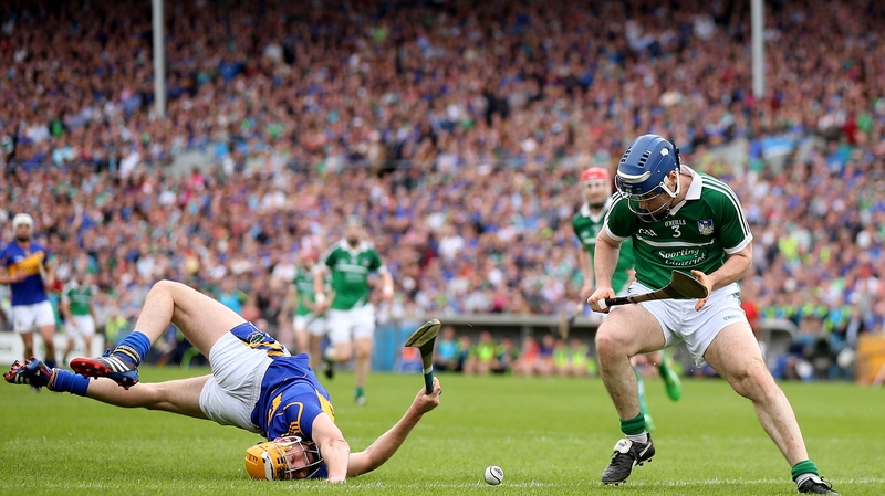 1 June - Tipperary's Seamus Callanan is all in a twist in the Munster semi-final at Semple Stadium - Richie McCarthy and Limerick finished the stronger to win by two points