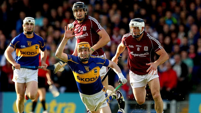 5 July - Galway's Joseph Cooney and Andy Smith are in pursuit of Lar Corbett as the sides met in the 'last chance saloon' stakes at Semple Stadium