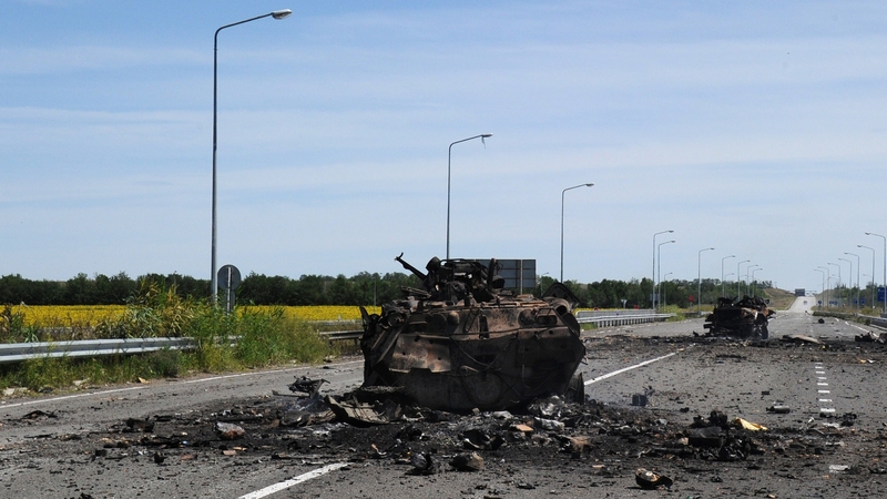 A destroyed armoured vehicle on the road of the airport in the south of Luhansk