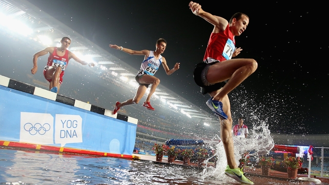 Athletes compete in the men's 2000metres steeplechase final at the Nanjing Youth Olympic Games in China