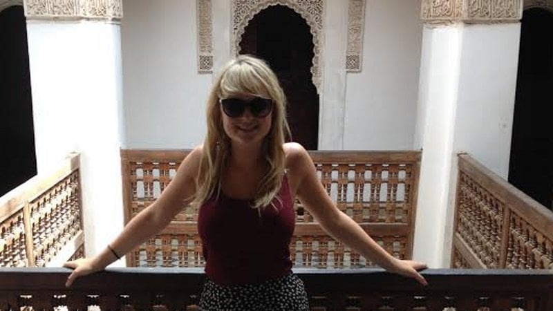 Sorcha Kehoe standing on the ornate balcony of the Ben Toussef Madrasa in Marrakesh, July 2014.