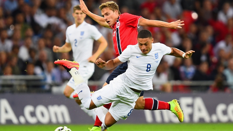 Ruben Yttergard Jenssen of Norway challenges Alex Oxlade-Chamberlain
