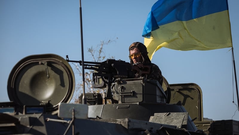 A Ukrainian soldier drives a military vehicle in eastern Ukrainian