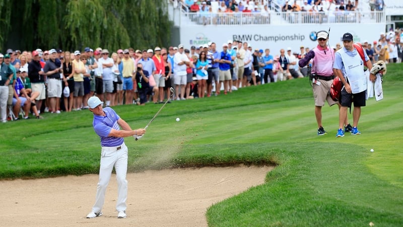 Rory McIlroy escapes from the bunker on the eighth hole at Cherry Hills
