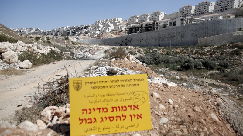An official Israeli sign from the Civil Administration in Charge of the Government Property, placed in the West Bank near the Israeli Beitar Illit (R) settlement