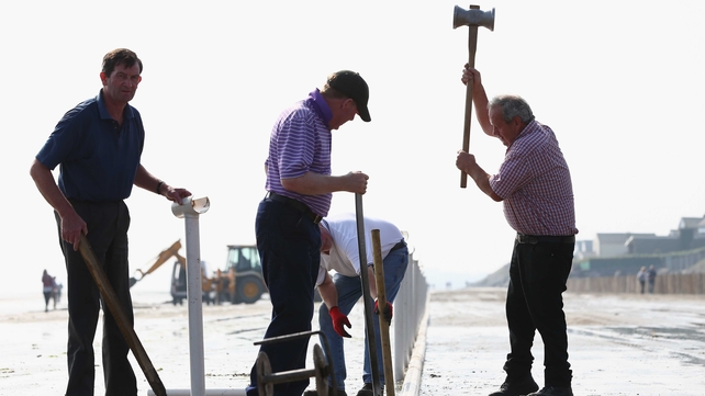 Nothing says welcome to the races like a man wielding an axe