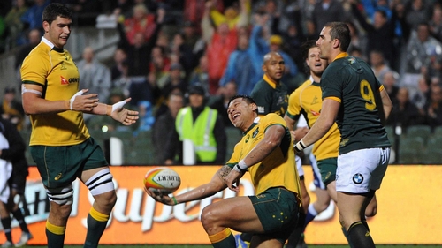 Israel Folau celebrates scoring Australia's first try