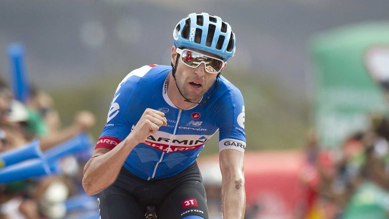 Ryder Hesjedal celebrates as he crosses the finish line to win the 14th stage