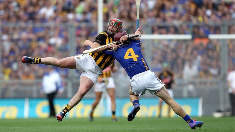 Kilkenny's Eoin Larkin and Paddy Stapleton of Tipperary tangle during the senior final