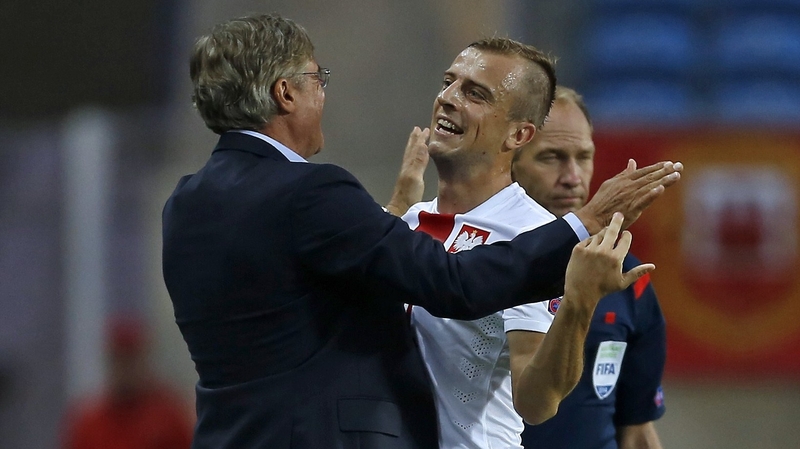 Kamil Grosicki celebrates a goal with coach Adam Nawalka