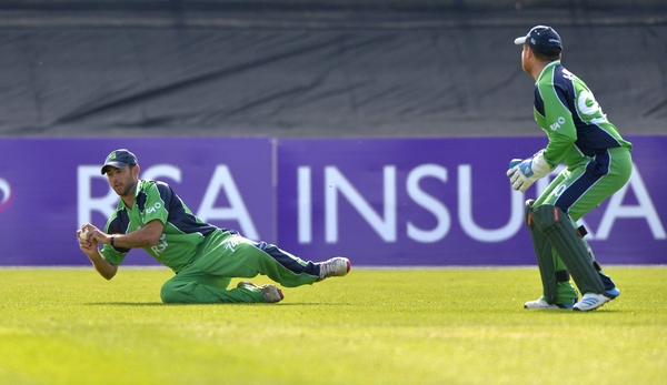 Ireland's John Anderson takes a catch to dismiss Calum MacLeod of Scotland