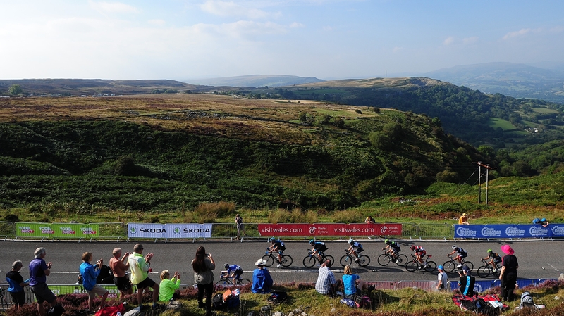 The peloton make their way up the final climb during stage three from Newtown to Abergavenny in Wales
