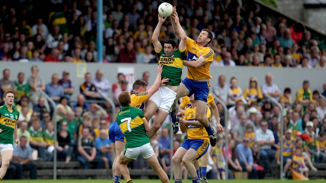 22 June - Clare's Gary Brennan and Bryan Sheehan jump highest in what was a tough enough assignment for the Kingdom as they prevailed by 1-17 to 1-13