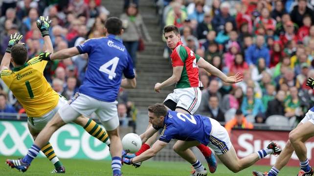 24 August - Mayo's Alan Freeman has his shot for goal blocked by the Kerry defence during the All-Ireland semi-final at Croke Park
