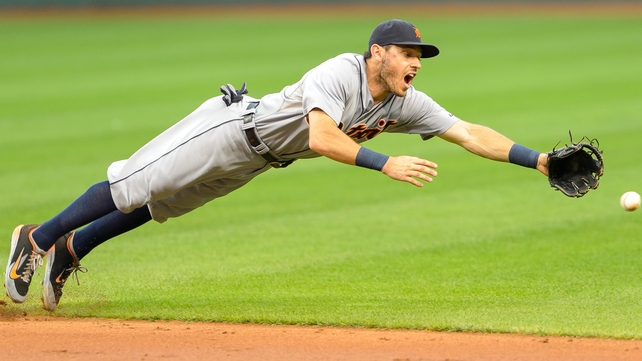 Ian Kinsler of the Detroit Tigers dives for a ground ball against Cleveland Indians at Progressive Field in Ohio