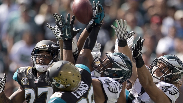 The Philadelphia Eagles and the Jacksonville Jaguars contest a Hail Mary pass during their NFL tie in Pennsylvania