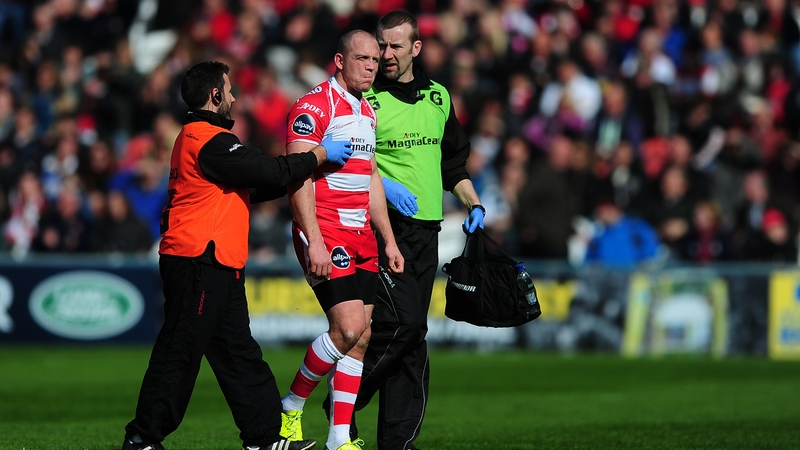 Gloucester rugby player Mike Tindall is escorted from the field for a concussion assessment during a game last season