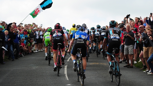 The peloton make their way up the final 100m to the submit of Hay Tor during stage five from Exmouth to Exeter