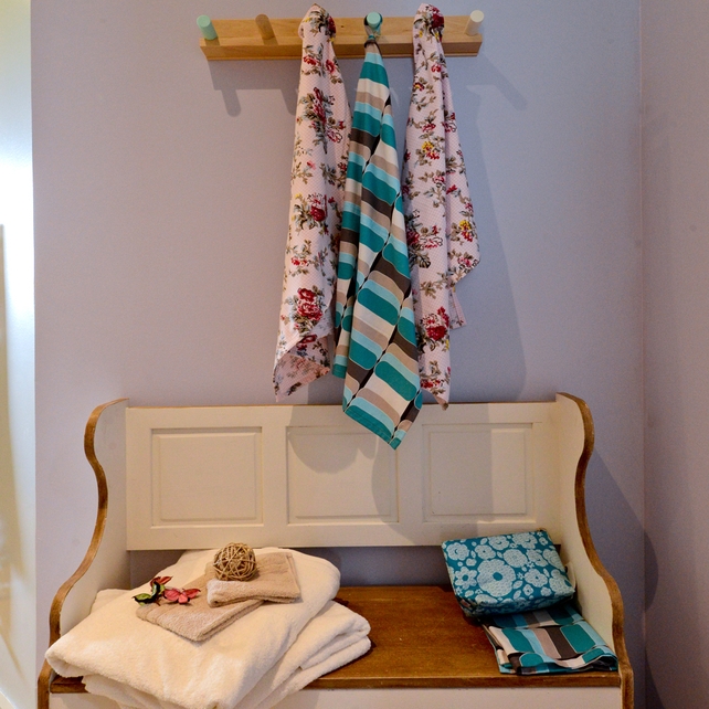 Wall rail; IKEA PS 2014 Rail knobs, assorted colours. € 6.00 http://www.ikea.com/ie/en/ | Multi Coloured Towels: Individually priced, www.avoca.ie