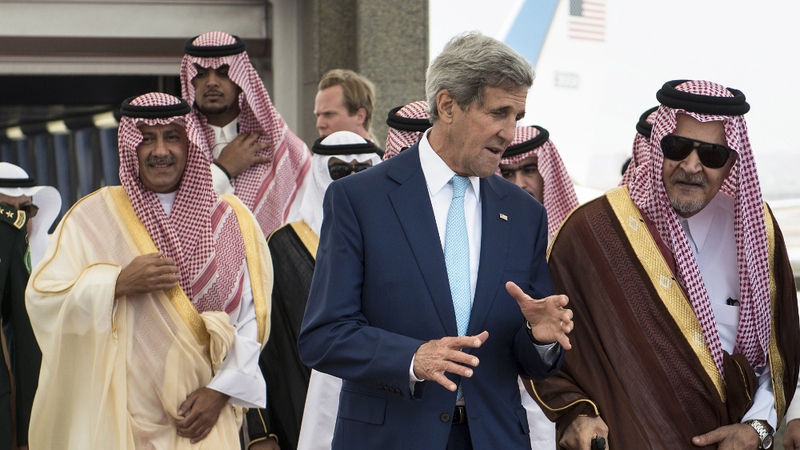 US Secretary of State John Kerry speaks with Prince Saud al-Faisal (R), foreign minister of Saudi Arabia, at King Abdulaziz International Airport
