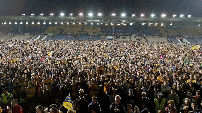 Clare hurling fans throng the pitch at Semple Stadium after their side's All-Ireland Under-21 final win over Wexford