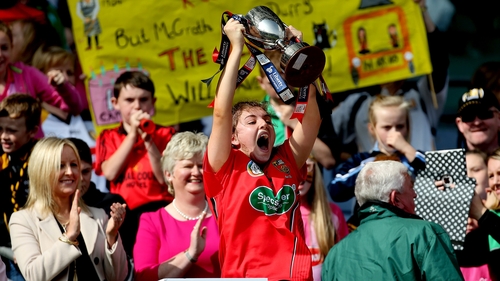 Down captain Niamh Mallon proudly lifts the trophy after victory