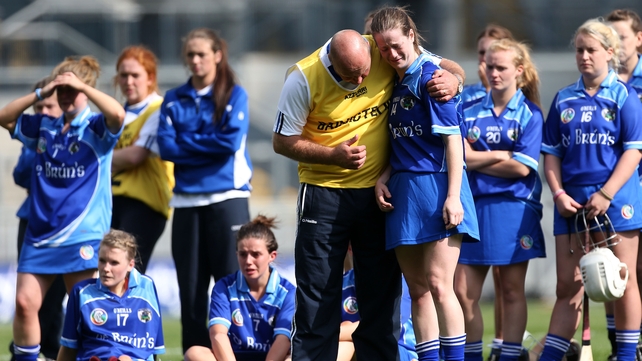 Laois' Niamh Dollard is consoled by manager David Cuddy after the junior final