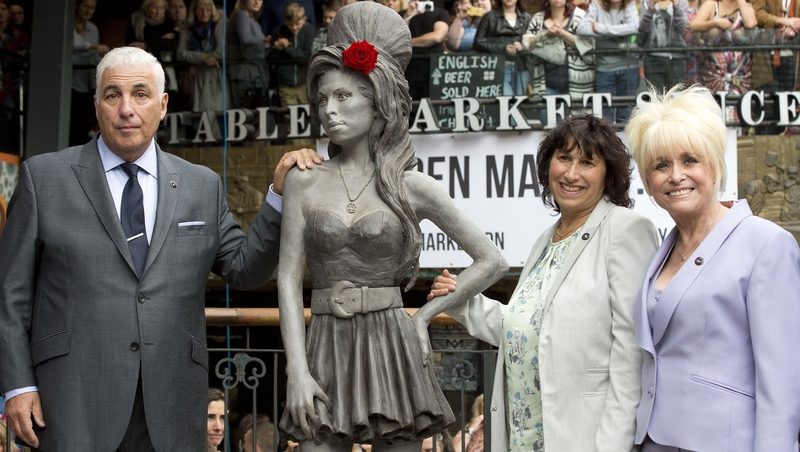 The parents of Amy Winehouse Mitch and Janis stand with Barbara Windsor at the unveiling of the statue in London