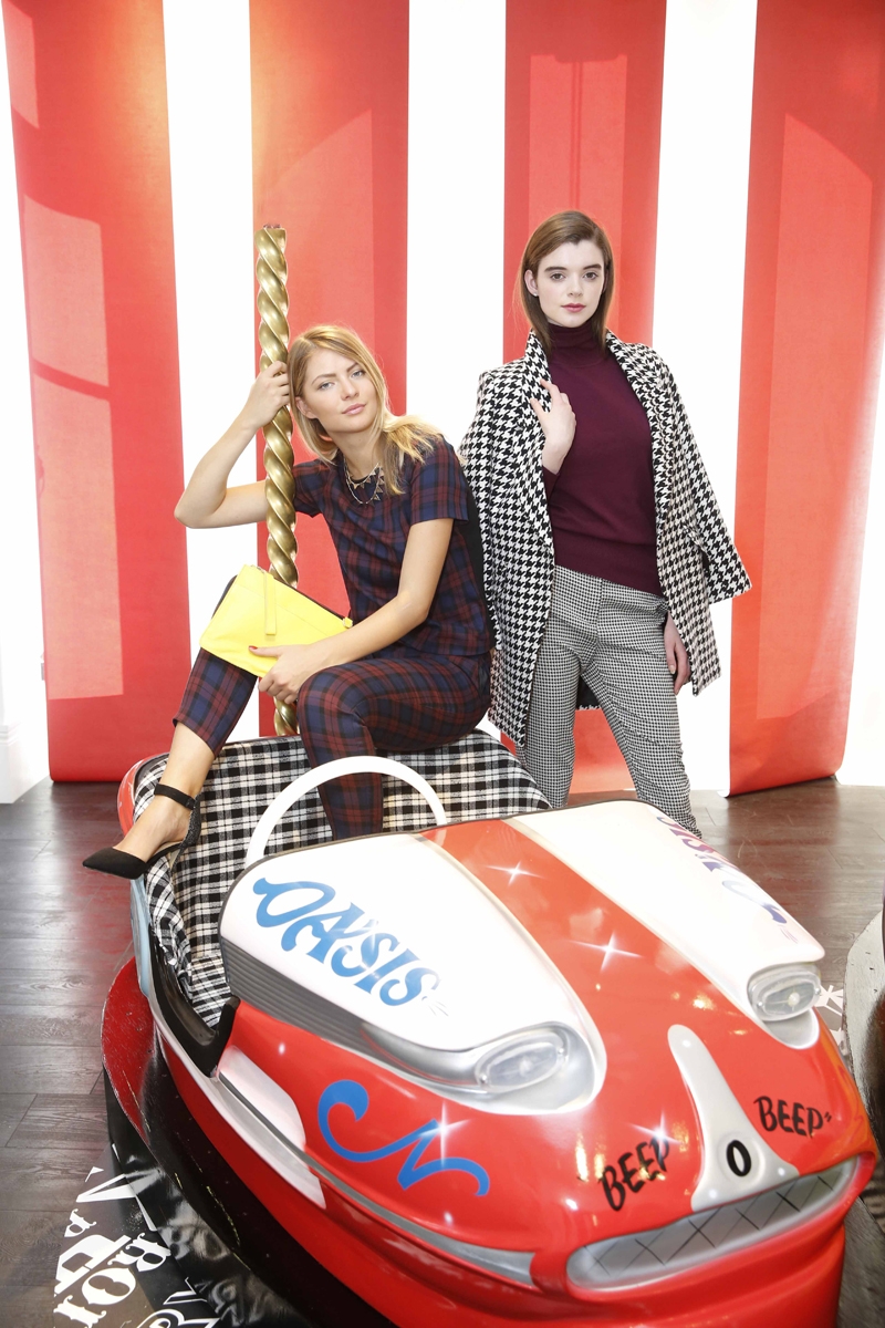 R: Dog tooth coat €125 Wine polo €45 Dog tooth trousers €50 Black boots €81. L: Check top €44 Check trousers €53 and yellow clutch €31 Necklace €15 Pointed court shoes €53