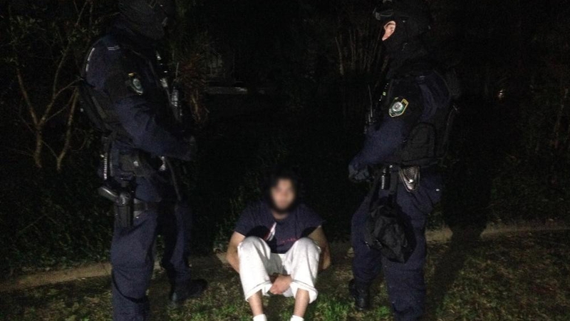 Hundreds of heavily armed Australian police raided homes in Sydney and Brisbane before dawn