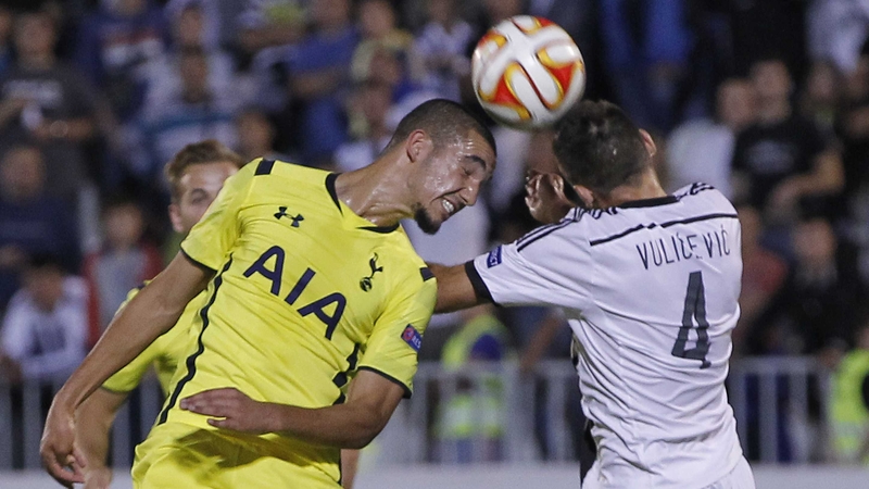 Bentaleb Nabil (left) of Tottenham jumps for the ball with Miroslav Vulicevic (right) of Partizan