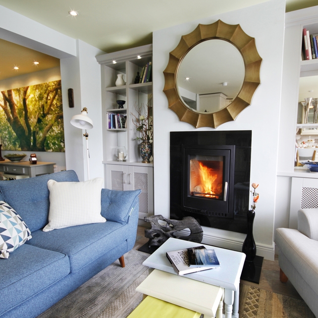 Two Seater Sofa: Barton, €1499 from www.dfs.ie | 
Rug: Woodstock Rug, €230 , www.rugoutlet.ie |
Stove: €1,590. Installation: €450, granite finish: Per home consultation |O’Rourke Fireplaces www.myfire.ie