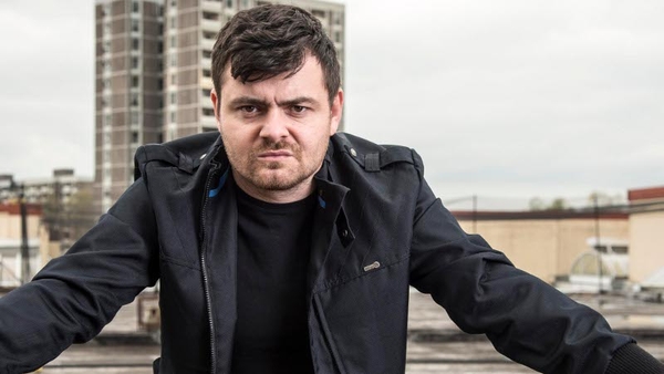 Laurence Kinlan as Elmo in Love/Hate