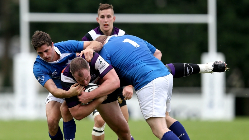 St Mary's Robbie Glynn and Brian McGovern tackle Gary Hamilton of Terenure