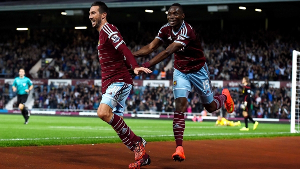 West Ham's Morgan Amalfitano celebrates with teammate Diafra Sakho after scoring his team's third goal