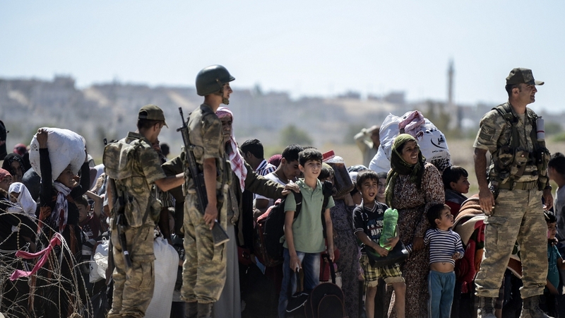 Turkey opened a stretch of the frontier yesterday after Kurdish civilians fled their homes