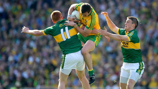 Leo McLoone tries to break free from the attention of Johnny Buckley