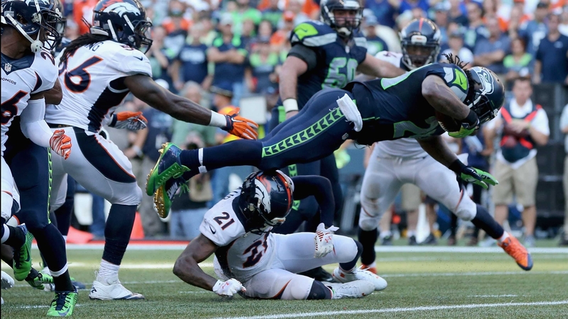 Marshawn Lynch leaps into the endzone to claim victory for the Seahawks at CenturyLink Field in Seattle