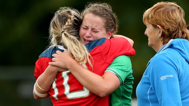 A family affair: Sisters Laura (Munster) and Emer (Connacht) O’Mahony at the final whistle of their inter-provincial clash on Saturday, watched by their mother Ann