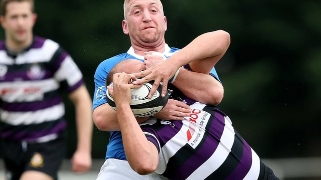 In the same game: St Mary's Richard Sweeney tackles Kyle McCloy of Terenure