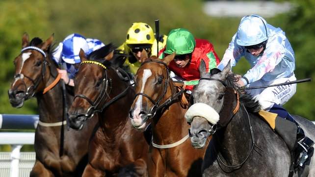 Ryan Moore riding Grandeur (R) wins The R H Hall Foundation Stakes at Goodwood racecourse on Wednesday