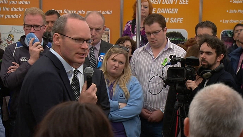 Simon Coveney met members of the farming community reeling over a beef crisis