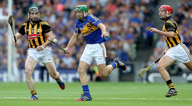 James Woodlock of Tipperary is put under pressure from the Cats defence
