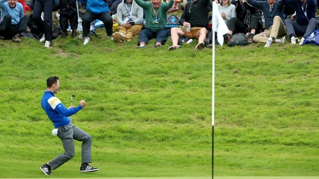 Martin Kaymer celebrates chipping in on the 16th hole to beat Bubba Watson